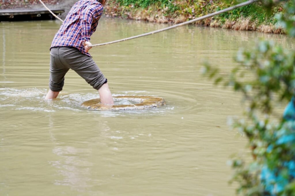 Guest doing water walking at Koka Ninja Village in Japan