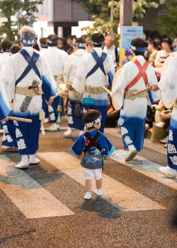 child in traditional clothes during summer in japan