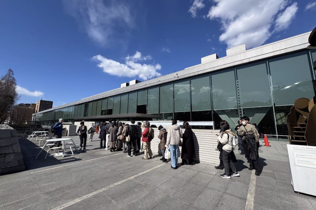 Crowrds queuing outside of Museum of Contemporary Art Tokyo for Ryuichi Sakamoto exhibition