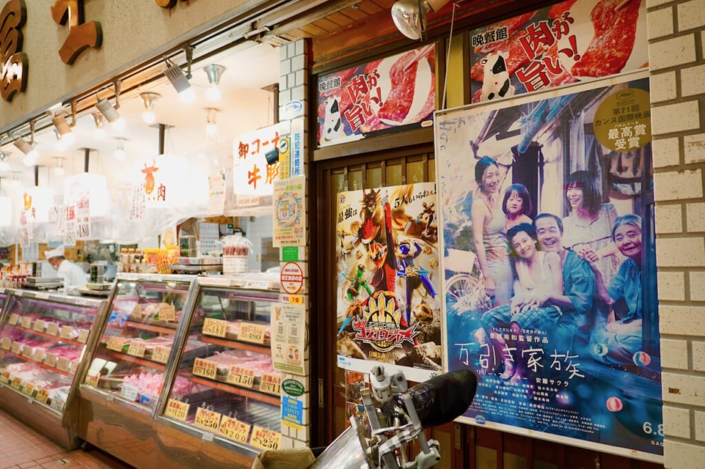 Joyful Minowa butcher shop with Shoplifters poster